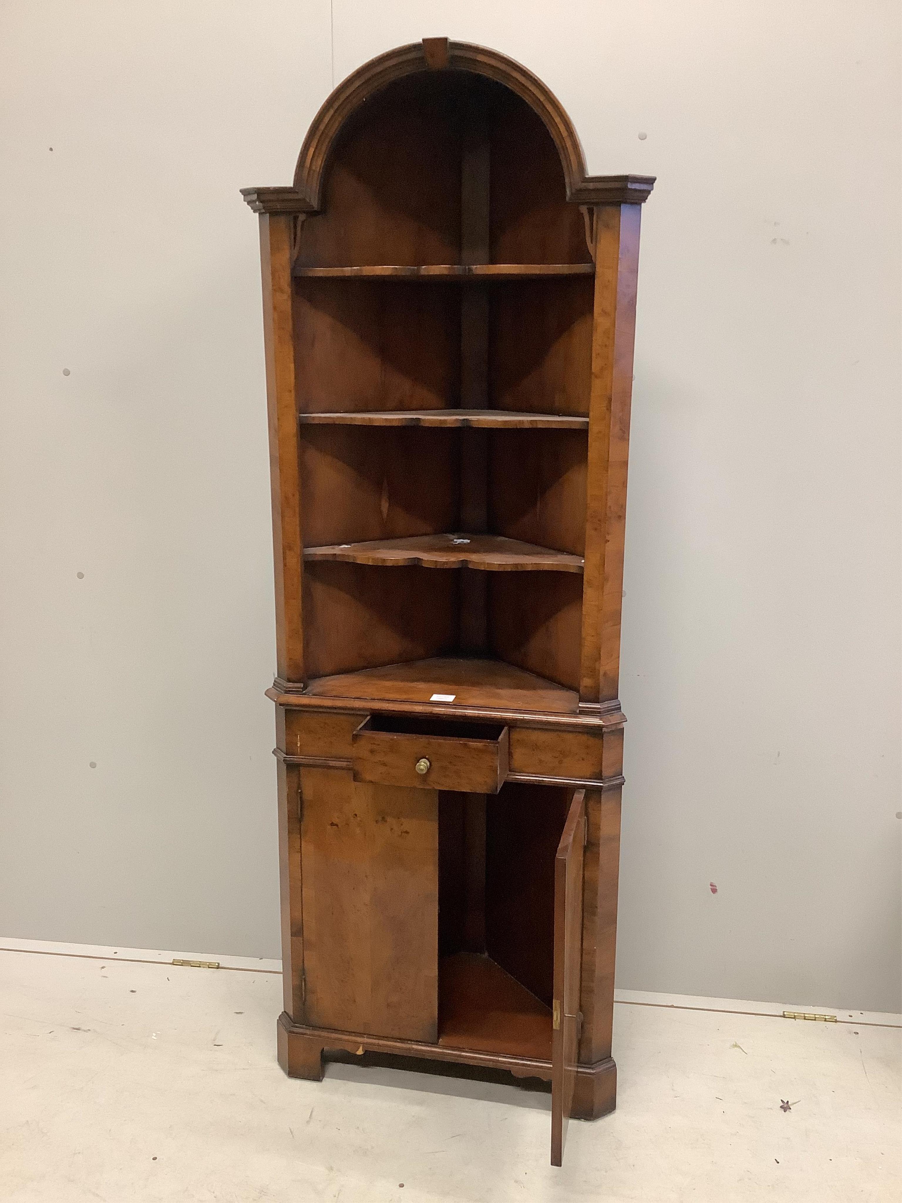 A Queen Anne Revival yew standing corner cupboard, width 66cm, depth 34cm, height 182cm. Condition - fair to good